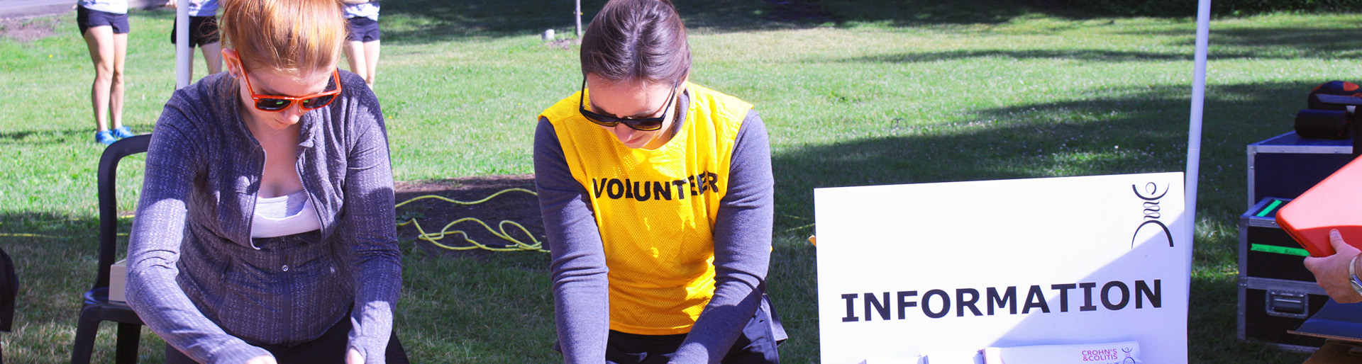 Volunteers working at a desk at Gutsy Walk