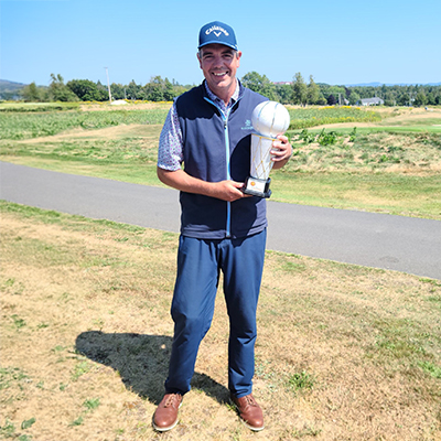 Evan McFarlane with golf trophy